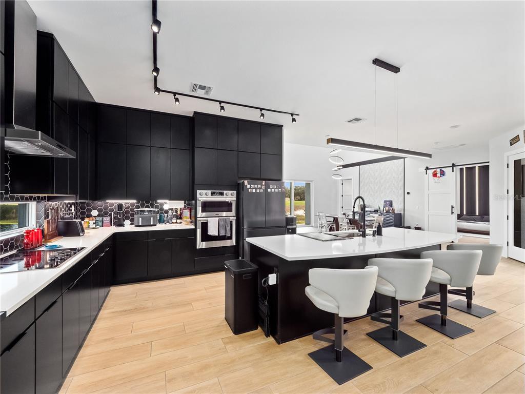 239 Hampton Loop Davenport, FL 33837 - Photo 18 of 43 a kitchen with a sink and cabinets