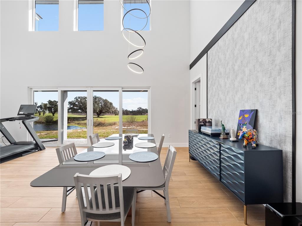 239 Hampton Loop Davenport, FL 33837 - Photo 20 of 43 a view of a dining room with furniture window and outside view