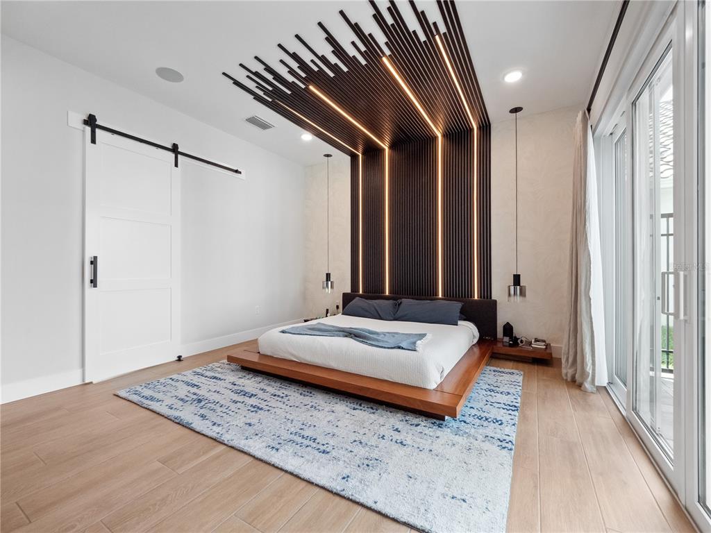 239 Hampton Loop Davenport, FL 33837 - Photo 22 of 43 a spacious bedroom with a bed and a dresser