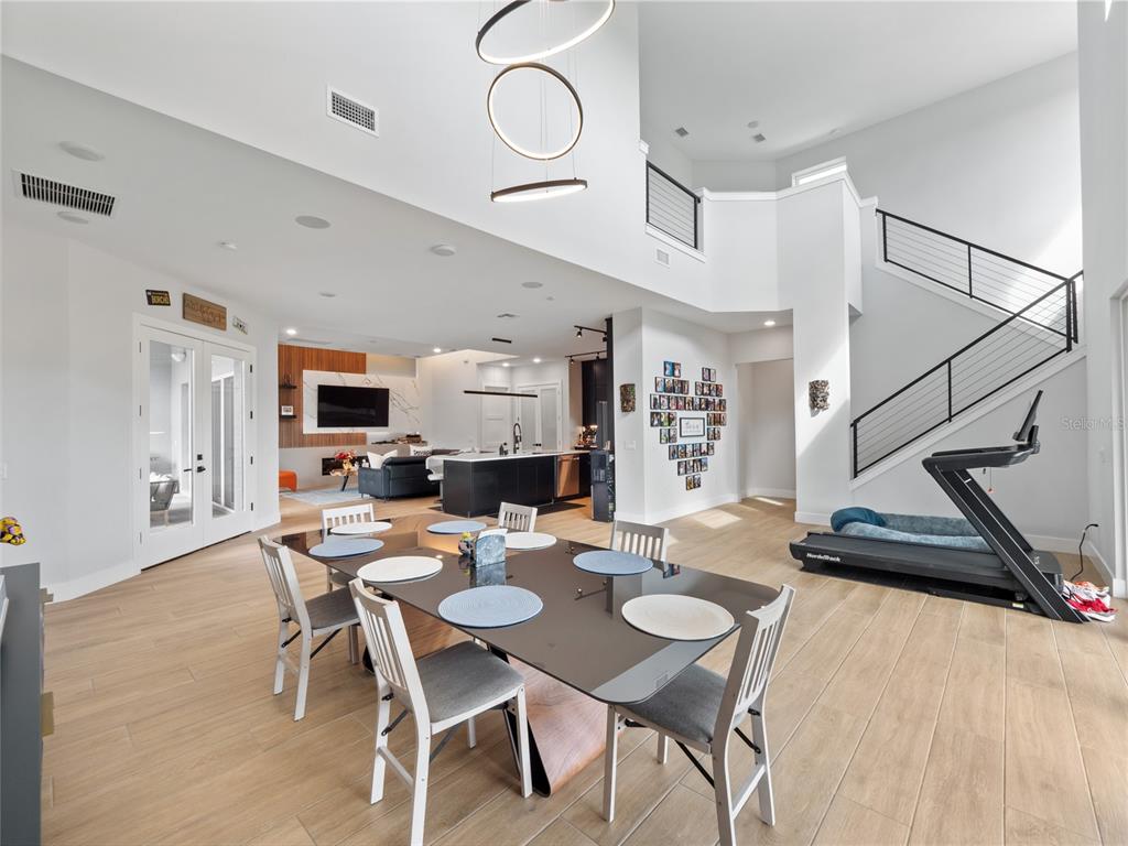 239 Hampton Loop Davenport, FL 33837 - Photo 30 of 43 a view of a dining room with furniture and wooden floor