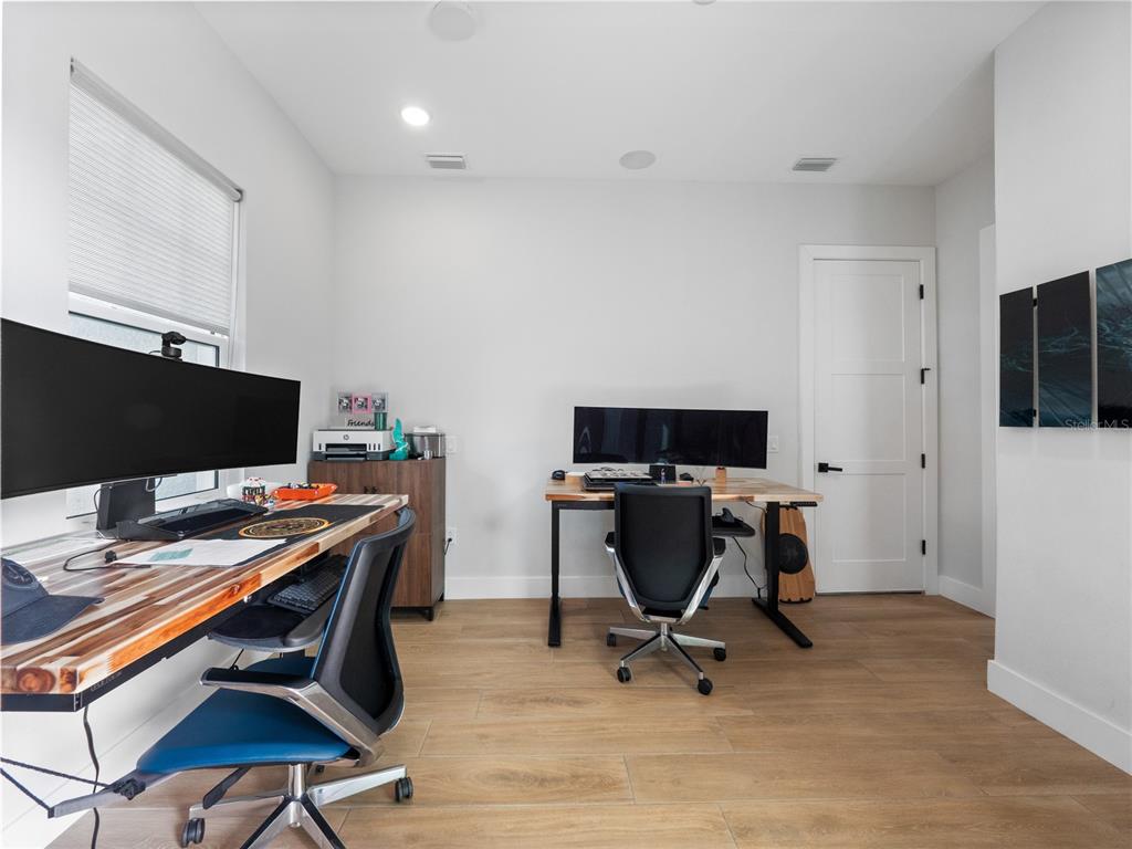 239 Hampton Loop Davenport, FL 33837 - Photo 36 of 43 a view of a workspace with furniture and a window