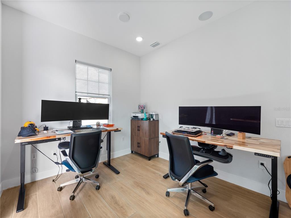 239 Hampton Loop Davenport, FL 33837 - Photo 37 of 43 a view of a workspace with furniture and a window