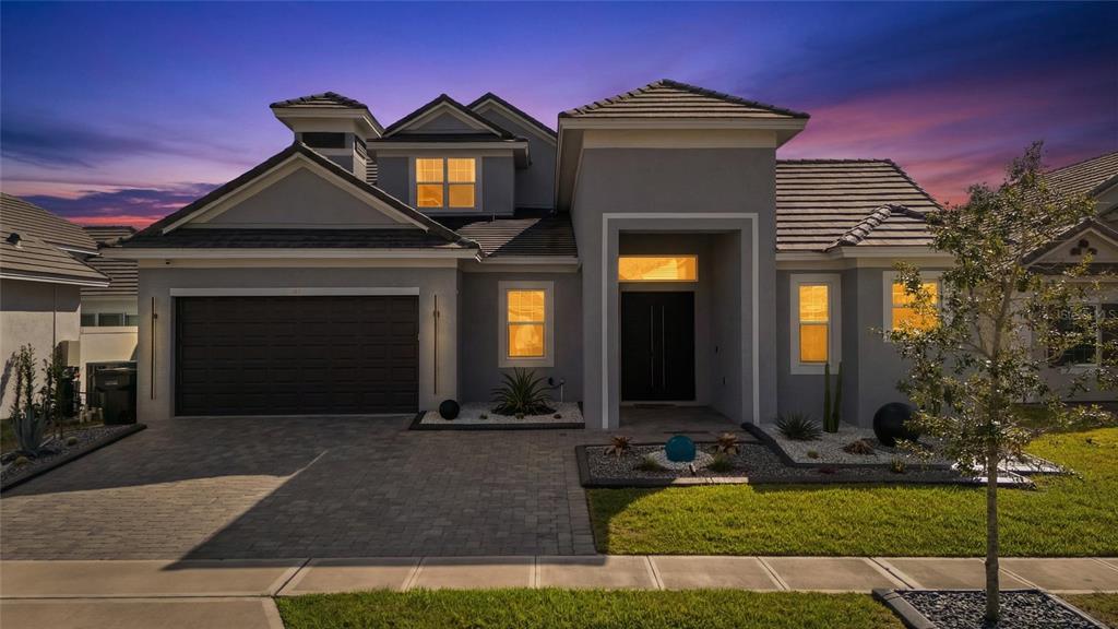 239 Hampton Loop Davenport, FL 33837 - Photo 41 of 43 a front view of a house with a yard