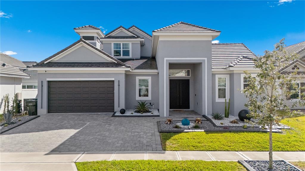 239 Hampton Loop Davenport, FL 33837 - Photo 42 of 43 a front view of a house with a yard