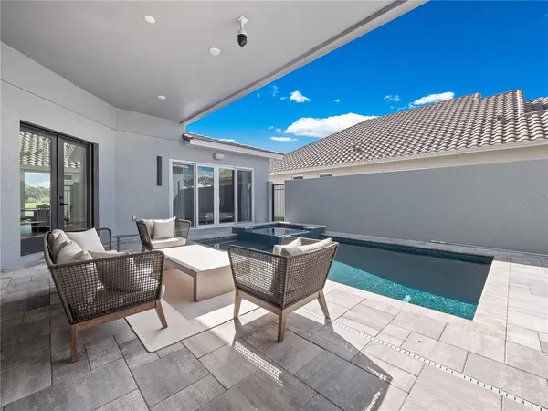 a dining room with a table and chairs
