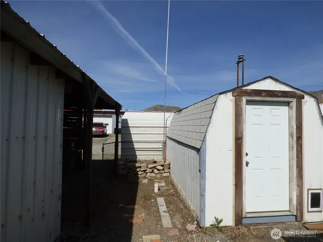 a view of a hallway with storage and utility