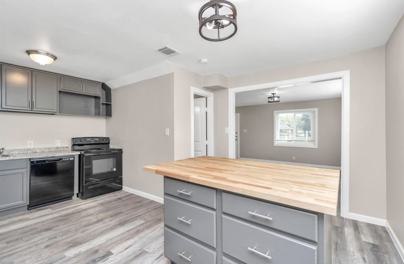 3404 Blodgett Street Houston, TX 77004 - Photo 13 of 19 a kitchen with stainless steel appliances granite countertop a stove and a sink
