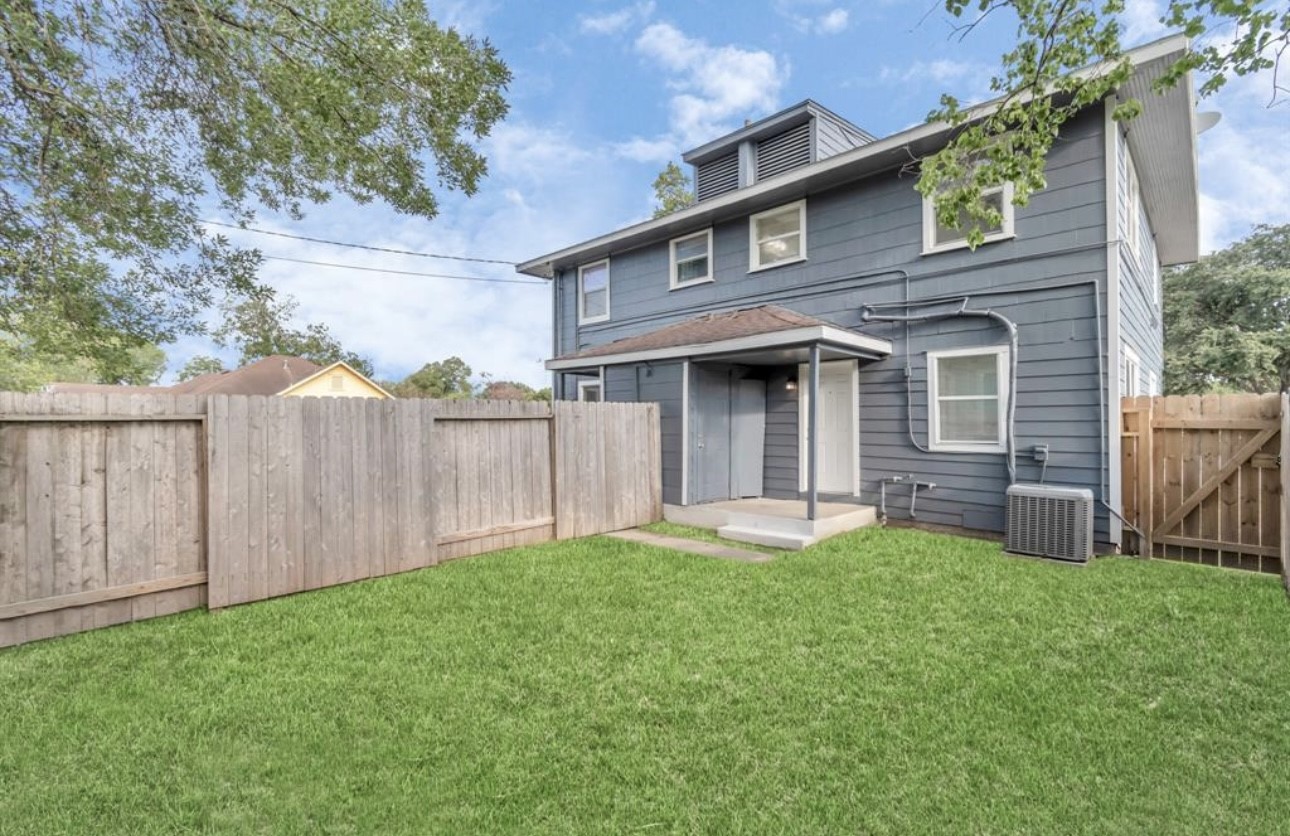 3404 Blodgett Street Houston, TX 77004 - Photo 17 of 19 a front view of a house with a yard and garage