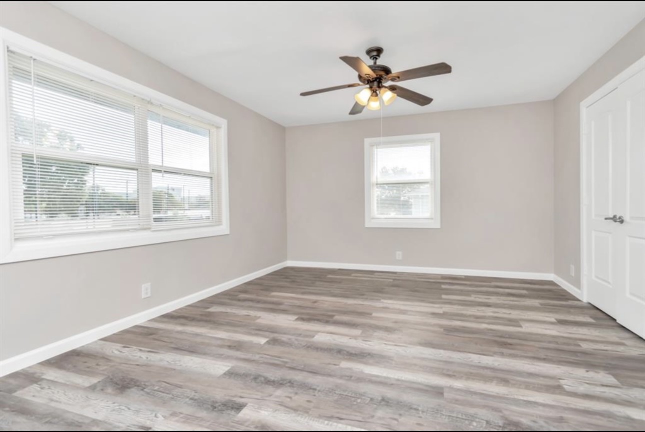 3404 Blodgett Street Houston, TX 77004 - Photo 3 of 19 a view of empty room with wooden floor and fan