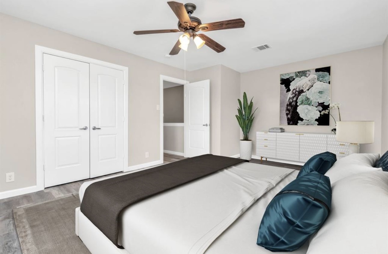 3404 Blodgett Street Houston, TX 77004 - Photo 4 of 19 a bedroom with a bed and a chandelier