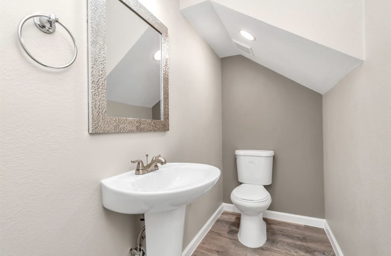 3404 Blodgett Street Houston, TX 77004 - Photo 8 of 19 a bathroom with a toilet a sink and mirror