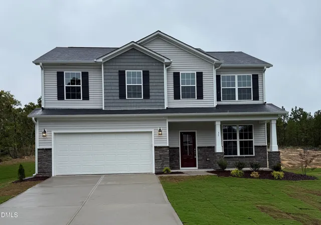 front view of a house with a yard