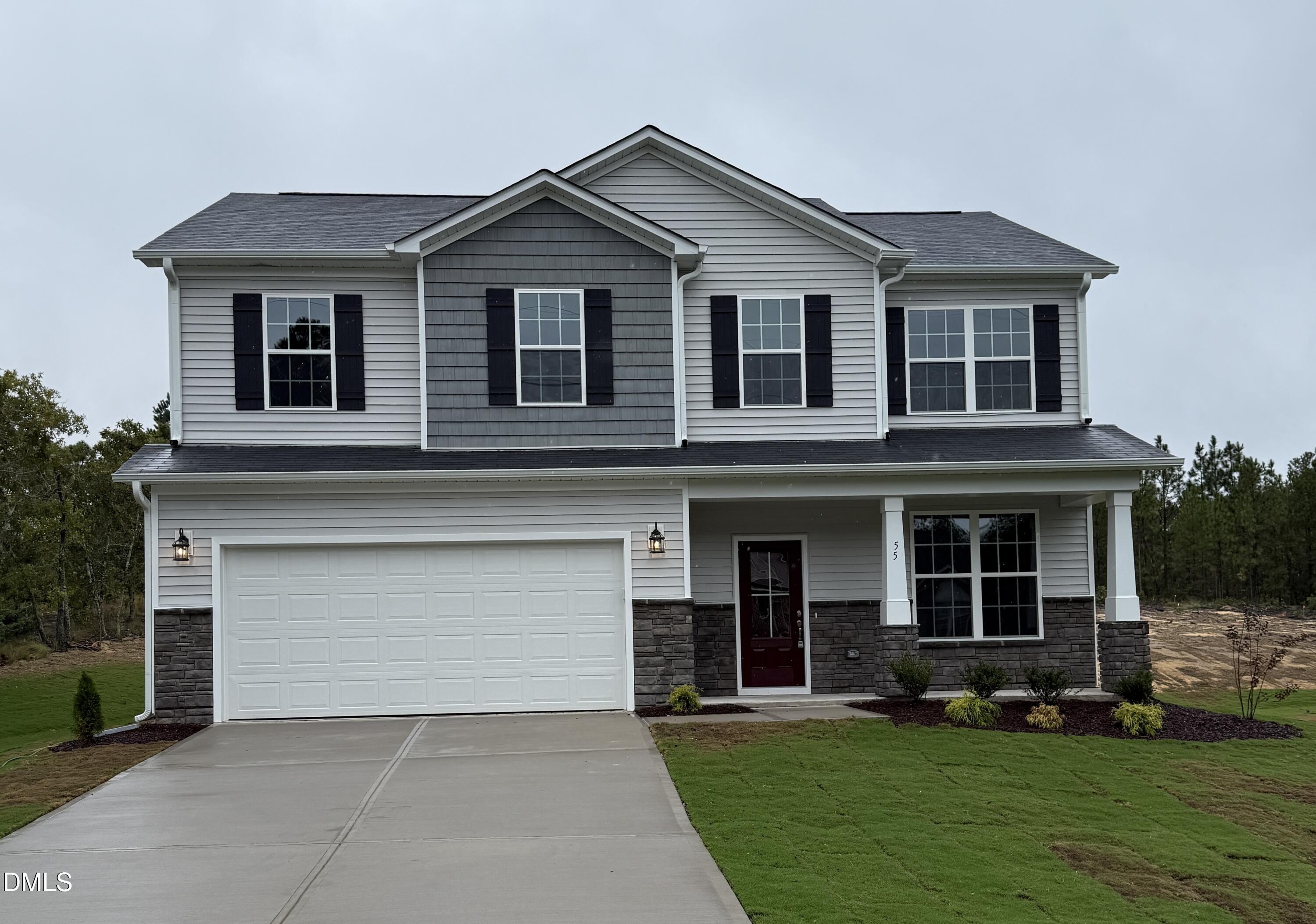 front view of a house with a yard