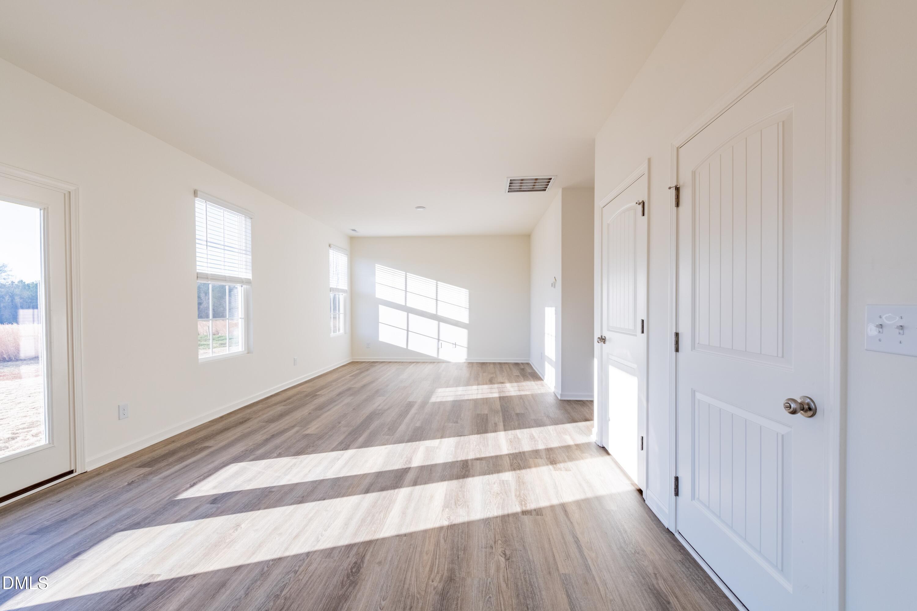 55 Fern Ridge Drive, Unit 1 Cameron, NC 28326 - Photo 11 of 42 a view of a room with wooden floor and window