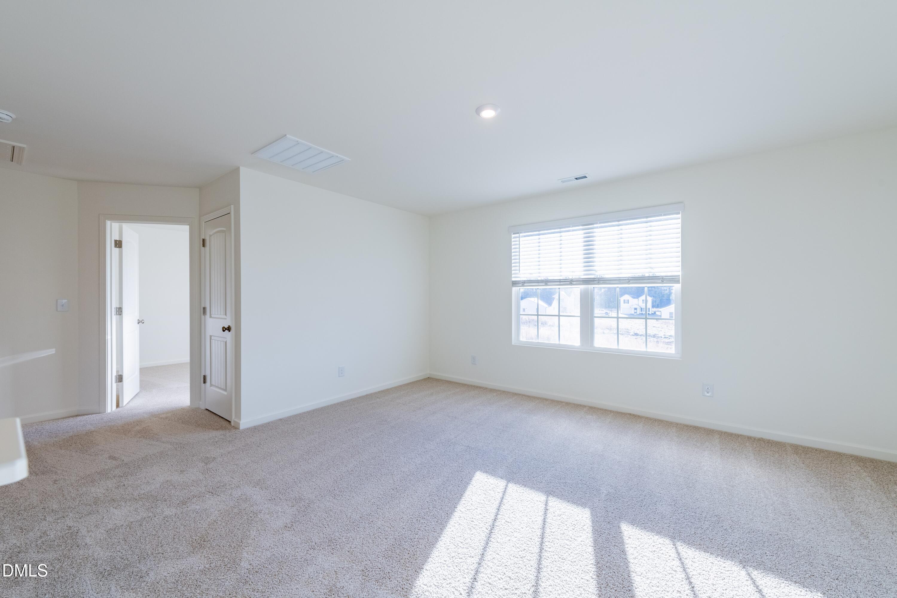 55 Fern Ridge Drive, Unit 1 Cameron, NC 28326 - Photo 26 of 42 an empty room with windows
