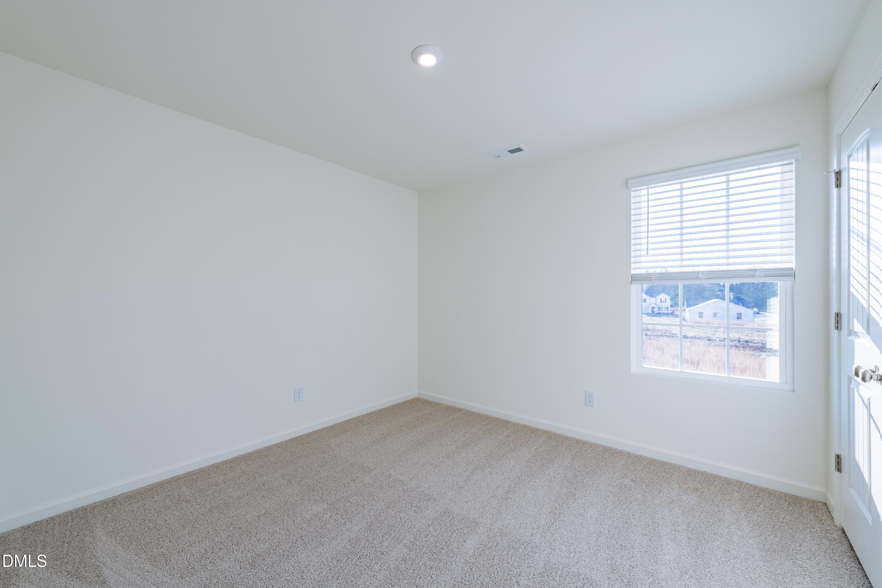 55 Fern Ridge Drive, Unit 1 Cameron, NC 28326 - Photo 29 of 42 an empty room with a window