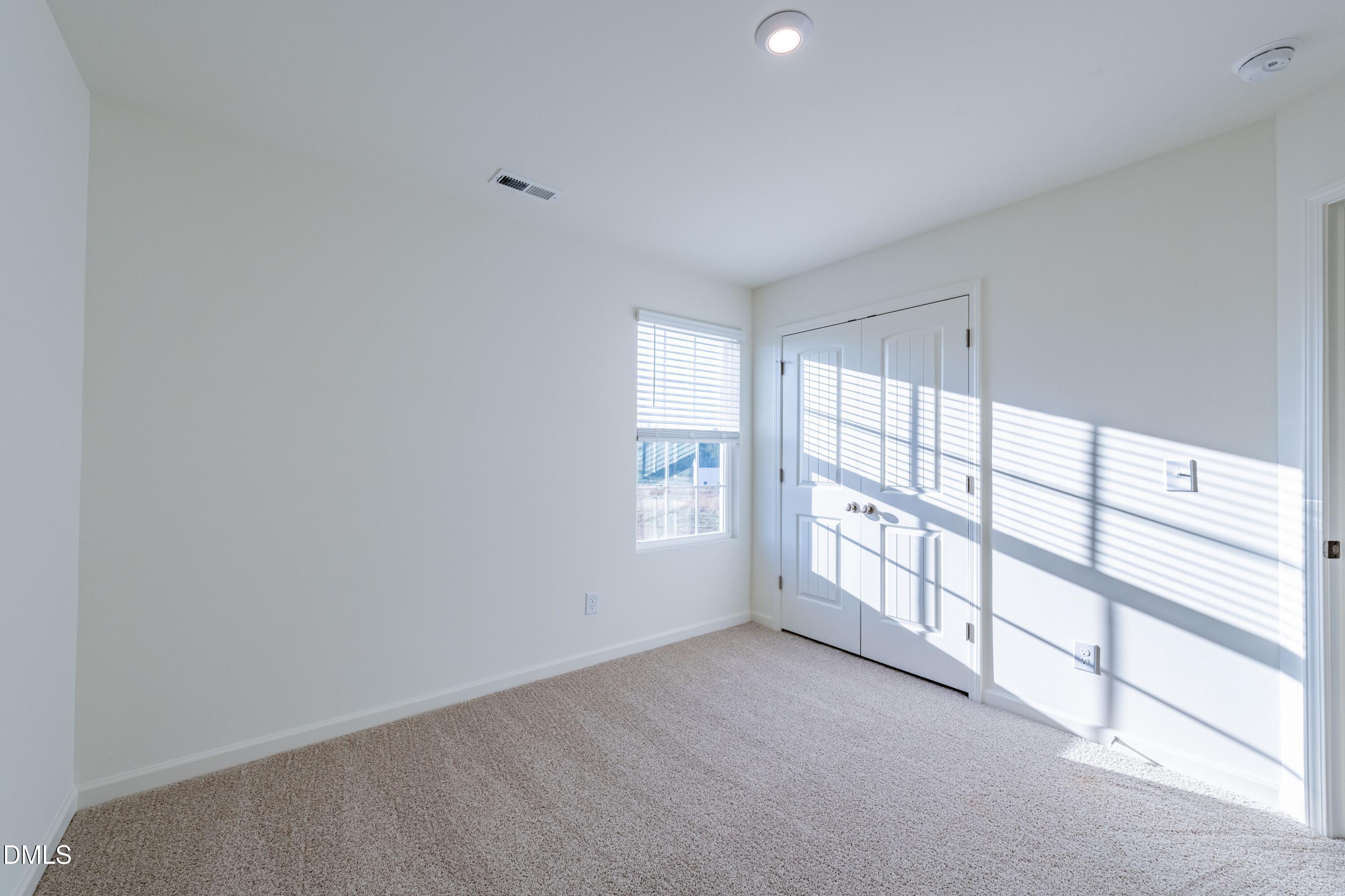 55 Fern Ridge Drive, Unit 1 Cameron, NC 28326 - Photo 30 of 42 a view of an empty room with a window