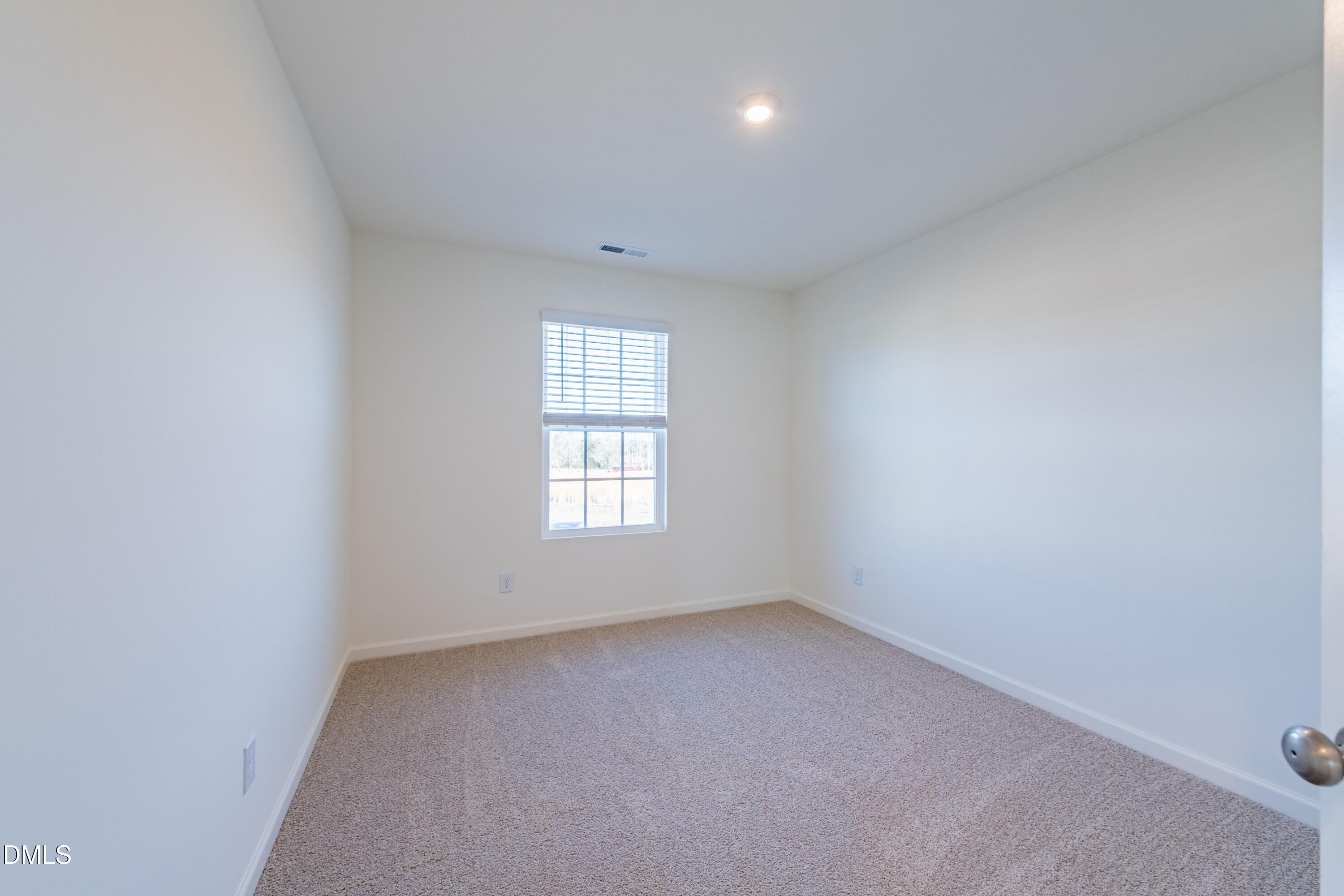 55 Fern Ridge Drive, Unit 1 Cameron, NC 28326 - Photo 34 of 42 an empty room with a window