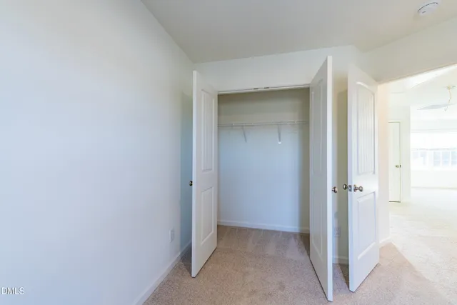 a view of a livingroom and a bathroom