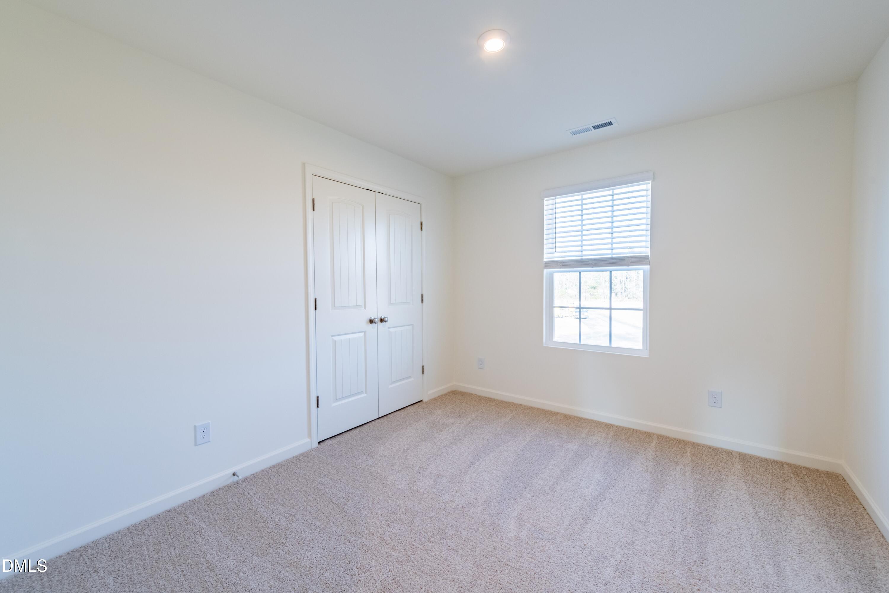 55 Fern Ridge Drive, Unit 1 Cameron, NC 28326 - Photo 37 of 42 an empty room with a window