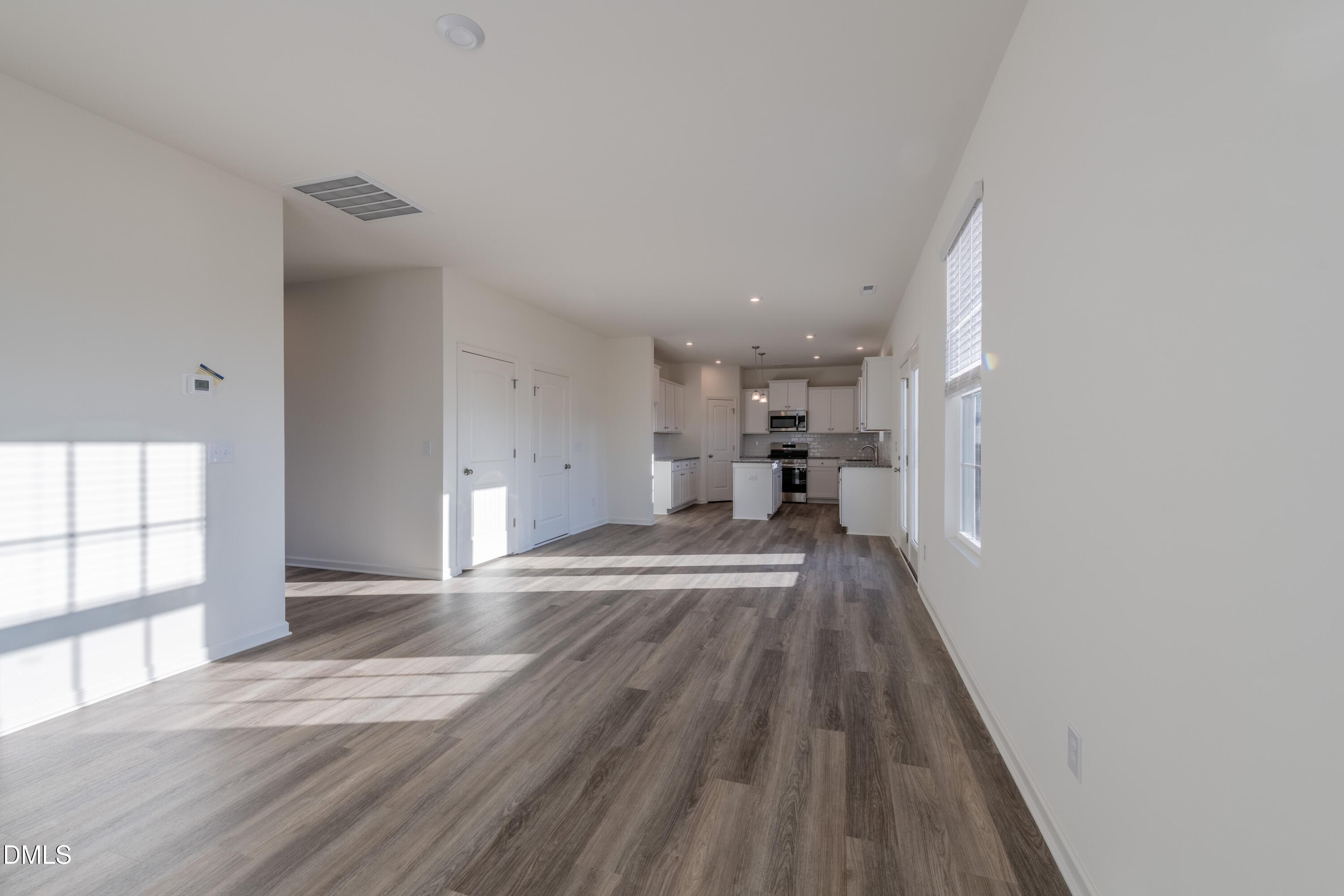 55 Fern Ridge Drive, Unit 1 Cameron, NC 28326 - Photo 9 of 42 a view of kitchen and wooden floor