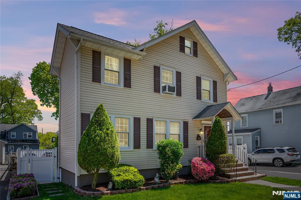 690 Garden Street Maywood, NJ 07607 - Photo 2 of 49 a front view of a house with garden