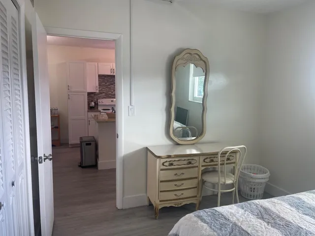 a bathroom with a sink a toilet and mirror