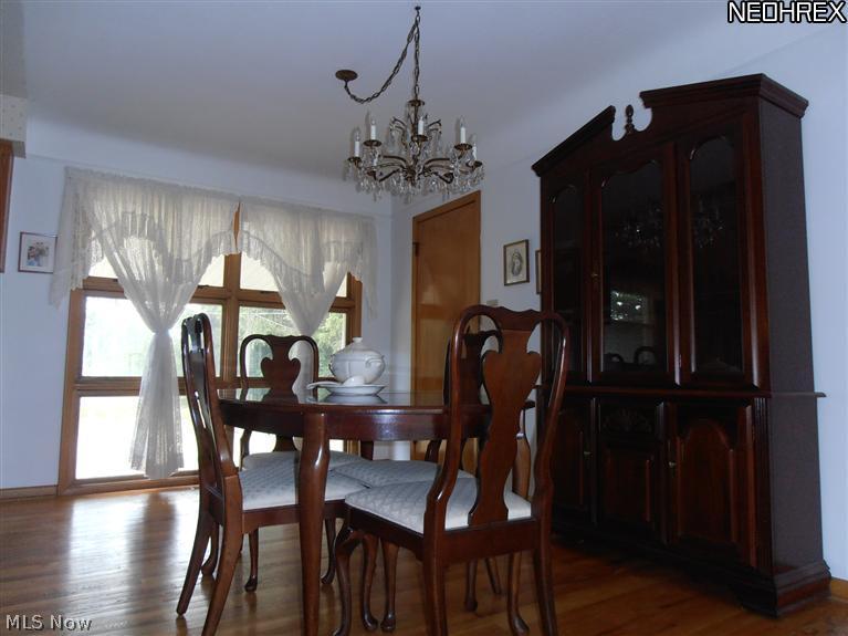 1248 Blanchester Road Lyndhurst, OH 44124 - Photo 6 of 11 Dining room with large picture window overlooks park like yard