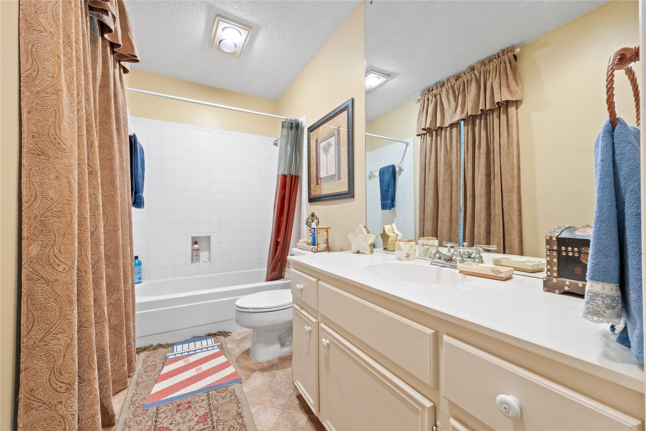 7639 Post Bridge Road Spring, TX 77389 - Photo 30 of 42 a bathroom with a sink a toilet and shower curtain