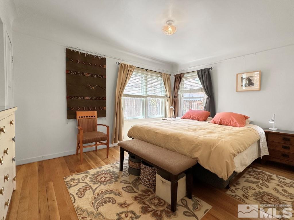987 Mt Rose Street Reno, NV 89509 - Photo 15 of 34 a spacious bedroom with a bed and a table