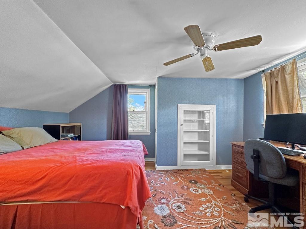 987 Mt Rose Street Reno, NV 89509 - Photo 18 of 34 a bed room with a bed and chair