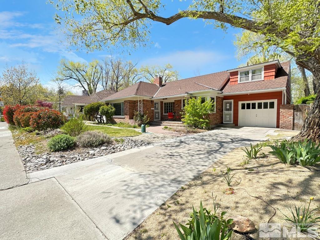 987 Mt Rose Street Reno, NV 89509 - Photo 2 of 34 a front view of a house with a yard