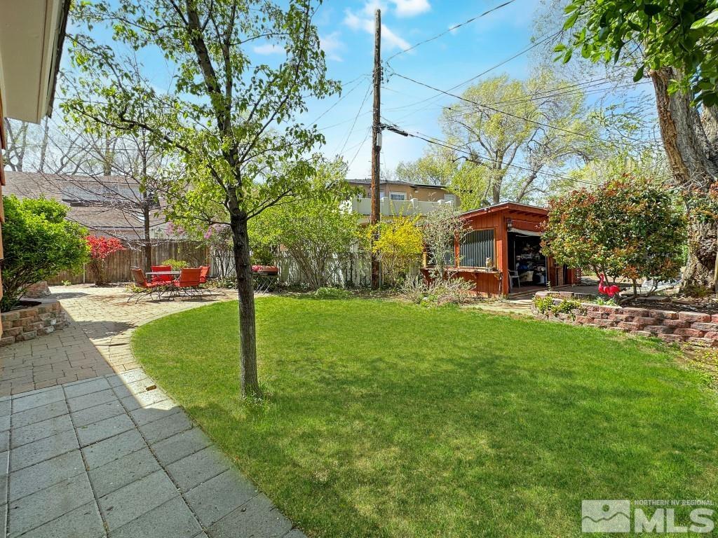 987 Mt Rose Street Reno, NV 89509 - Photo 28 of 34 a swimming pool with outdoor seating and yard