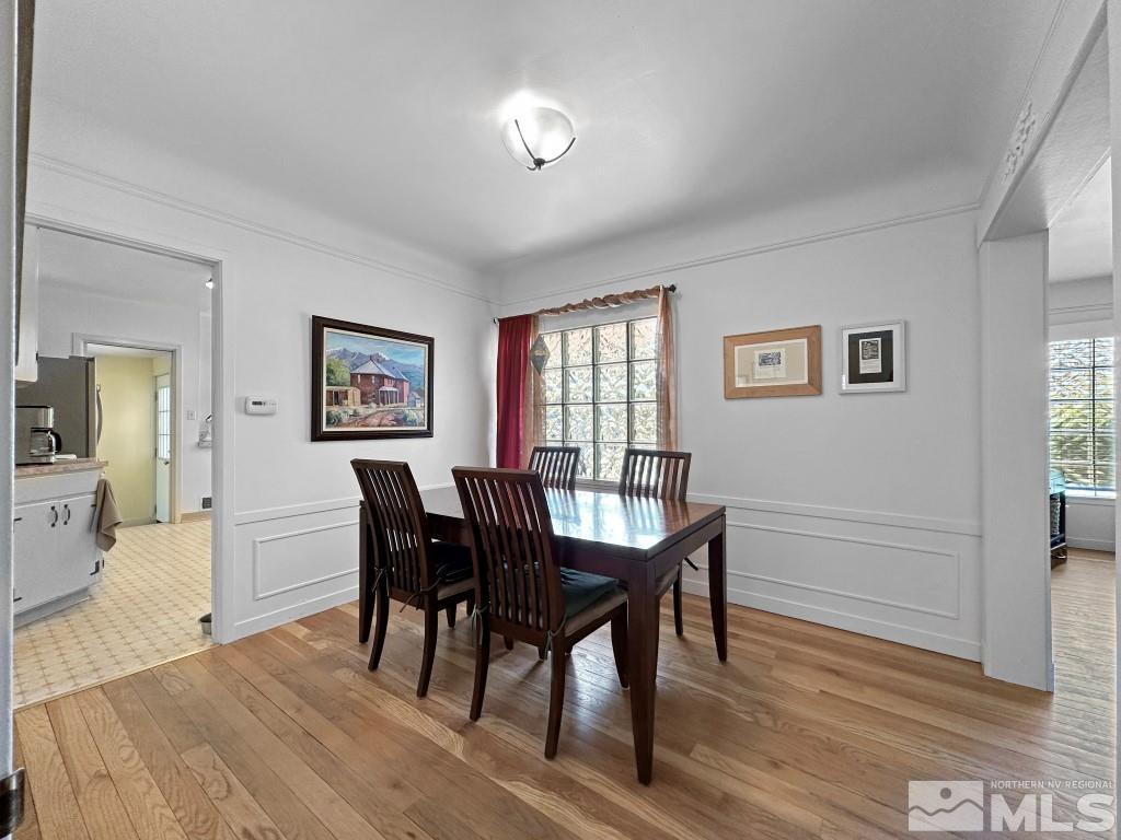 987 Mt Rose Street Reno, NV 89509 - Photo 8 of 34 a view of a dining room with furniture and wooden floor