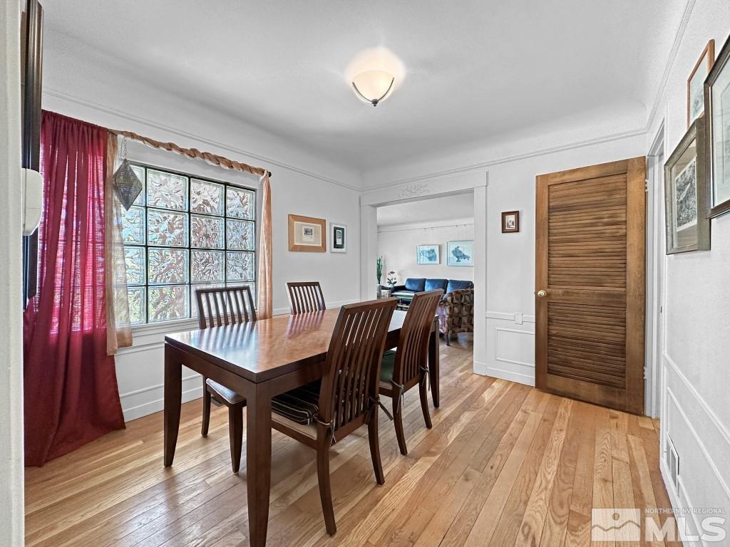 987 Mt Rose Street Reno, NV 89509 - Photo 9 of 34 a view of a dining room with furniture and wooden floor