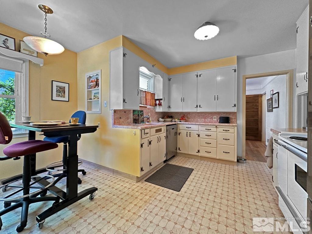 987 Mt Rose Street Reno, NV 89509 - Photo 10 of 34 a kitchen with a sink a counter cabinets and appliances