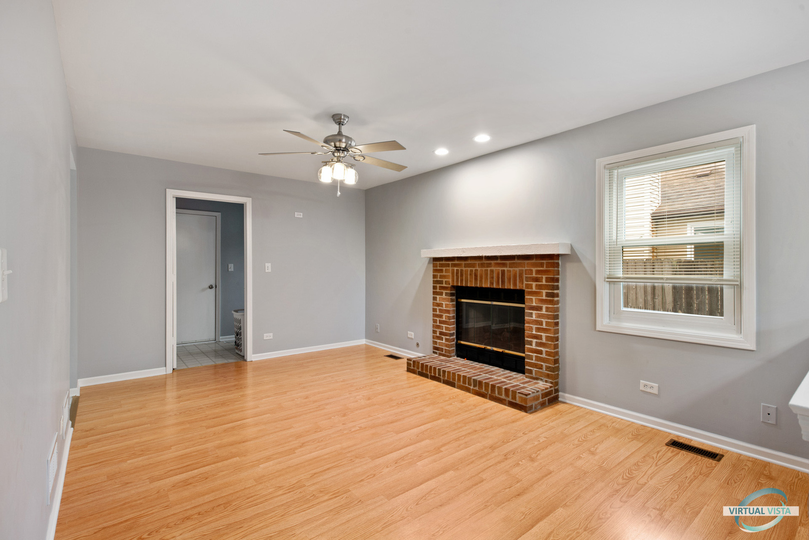960 Millwood Drive Bartlett, IL 60103 - Photo 13 of 33 a view of an empty room with window and fireplace