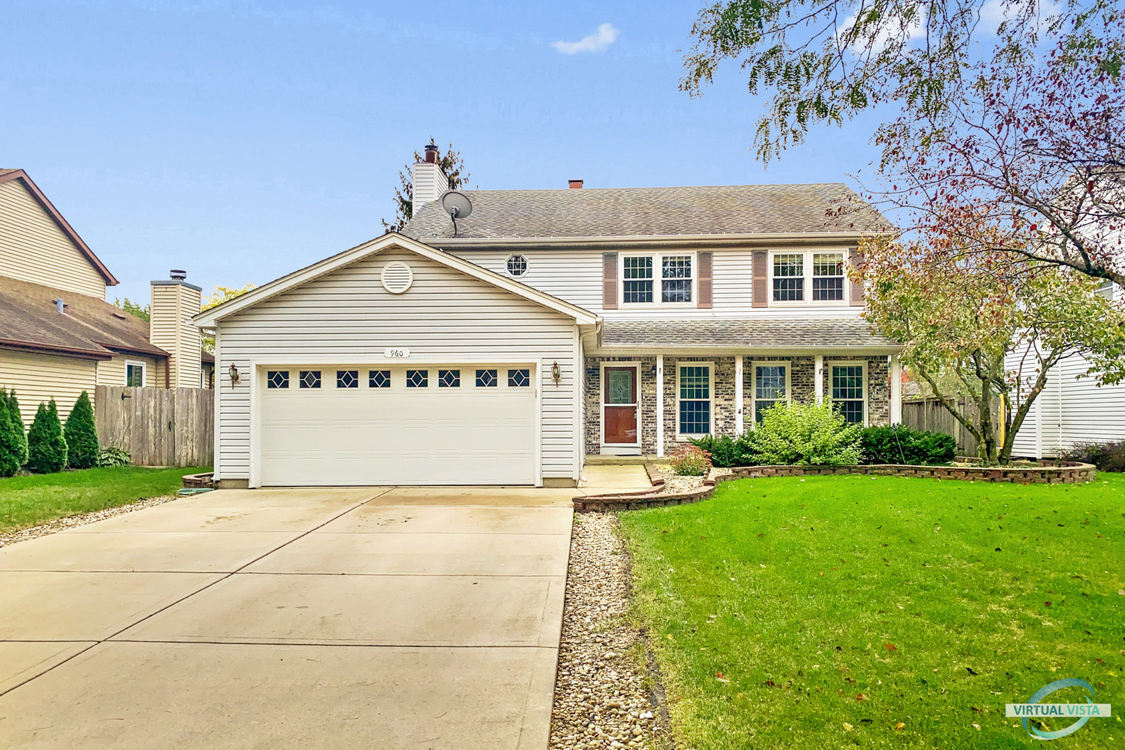 960 Millwood Drive Bartlett, IL 60103 - Photo 3 of 33 a front view of a house with garden