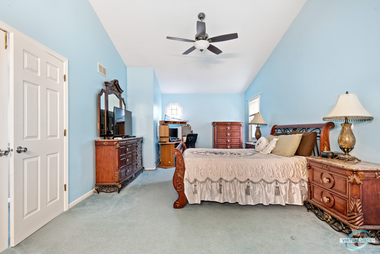 960 Millwood Drive Bartlett, IL 60103 - Photo 26 of 33 a bedroom with a bed and a chandelier