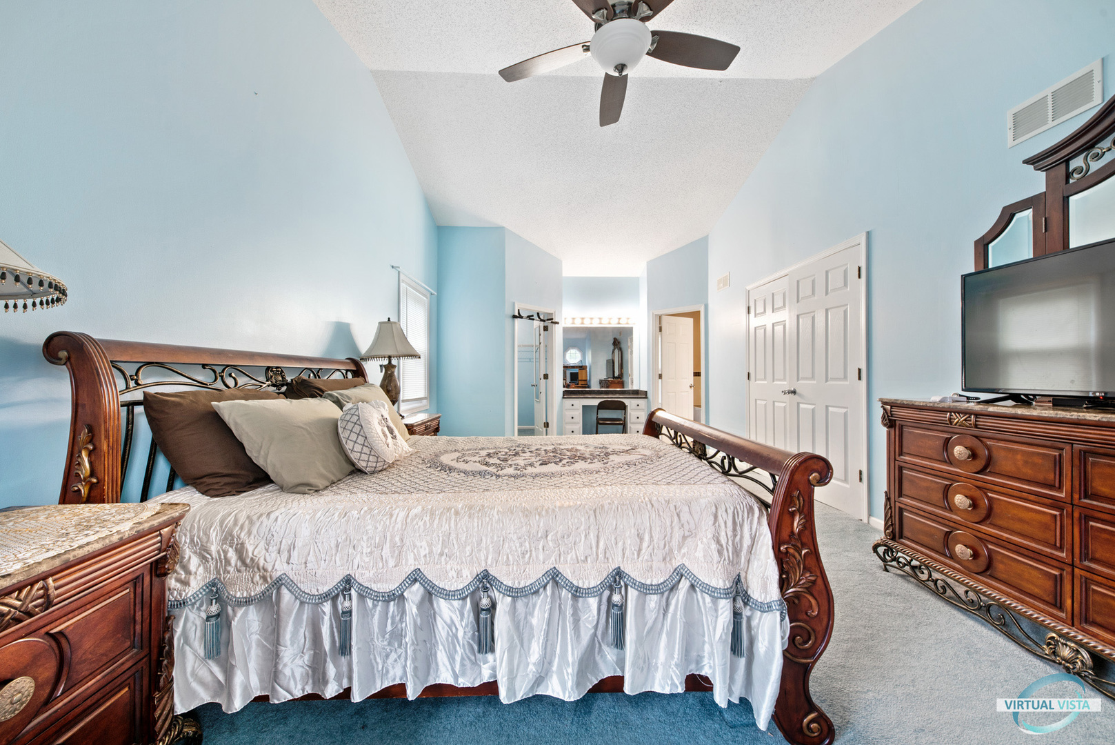 960 Millwood Drive Bartlett, IL 60103 - Photo 27 of 33 a bedroom with a bed and a flat screen tv