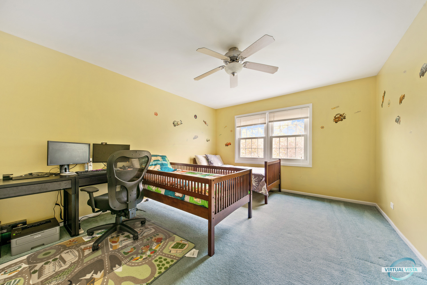 960 Millwood Drive Bartlett, IL 60103 - Photo 32 of 33 a living room with a bed furniture and a window