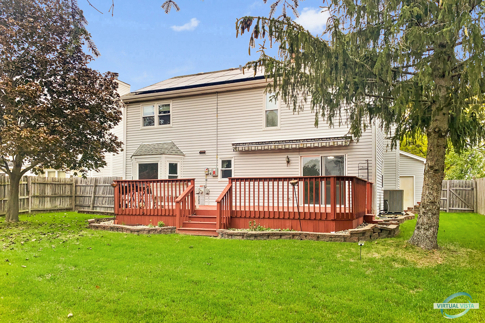 960 Millwood Drive Bartlett, IL 60103 - Photo 33 of 33 a view of a house with backyard and a tree