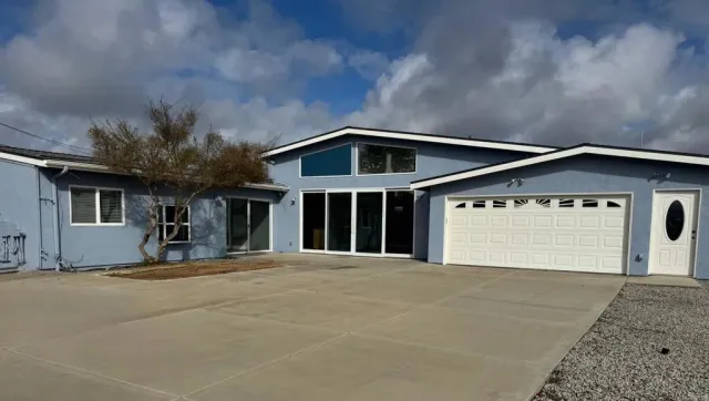 a front view of a house with a garage