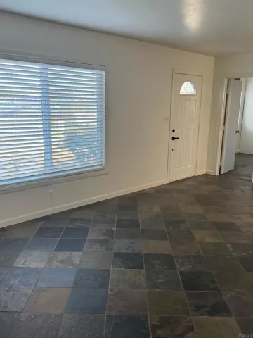 a view of an empty room with a window