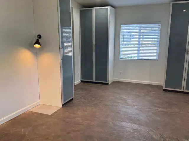 an empty room that has a window