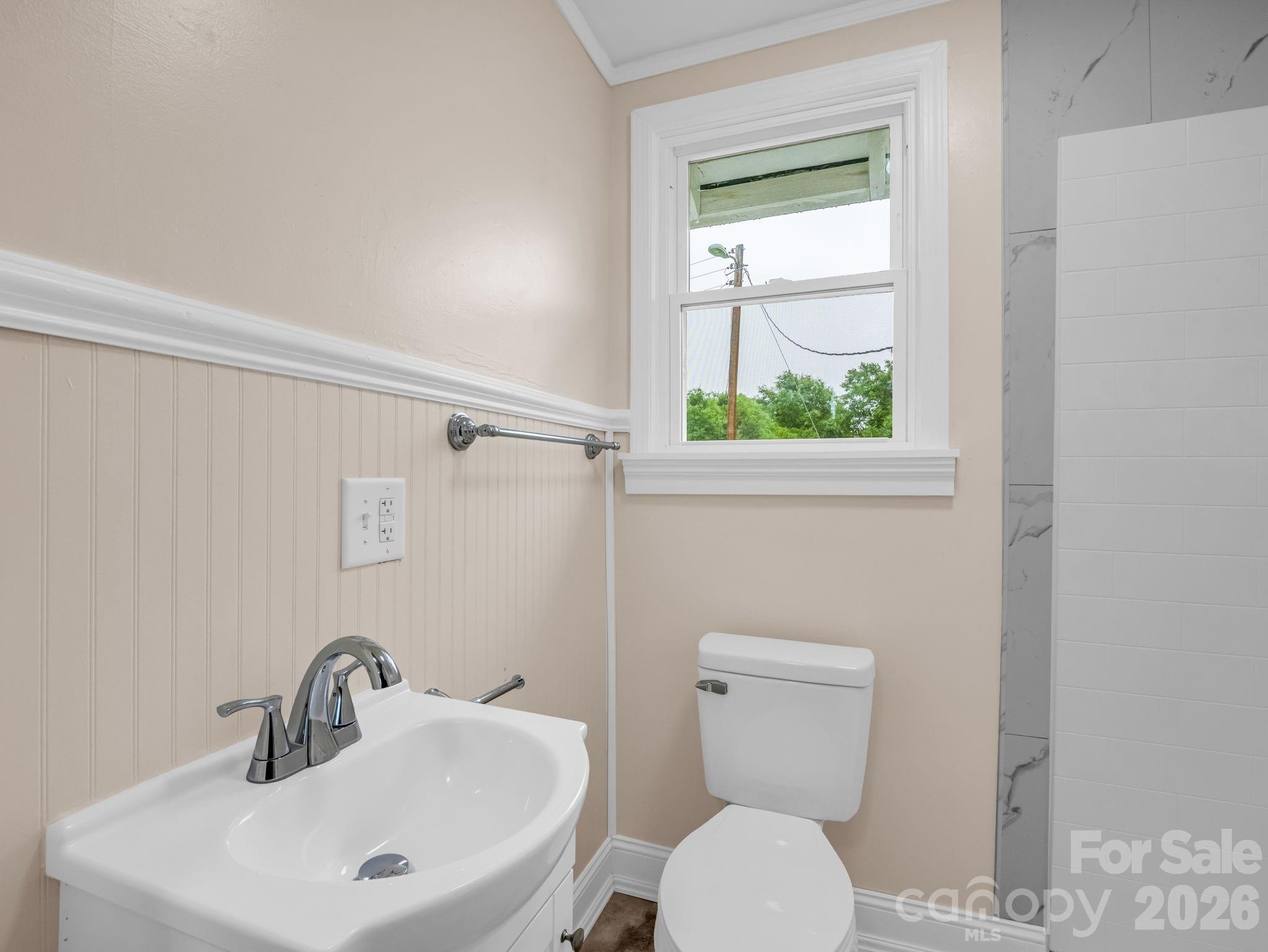 170 Dobbins Road Ellenboro, NC 28040 - Photo 24 of 32 a bathroom with a toilet a sink and a window