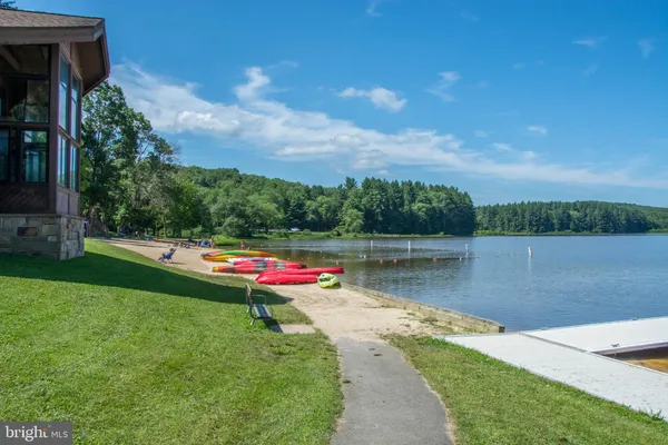 a view of a lake with houses in the back