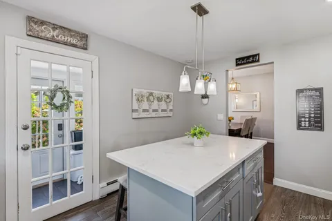 a view of kitchen island with furniture and wooden floor