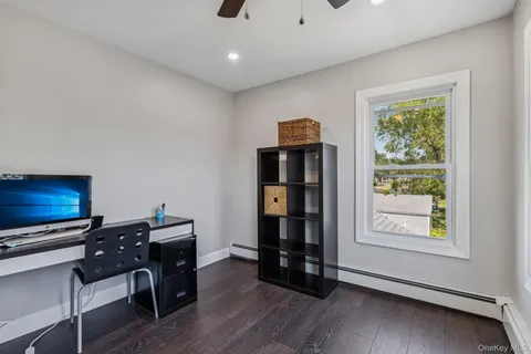 a view of workspace with furniture and window
