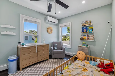 a bedroom with furniture and a window